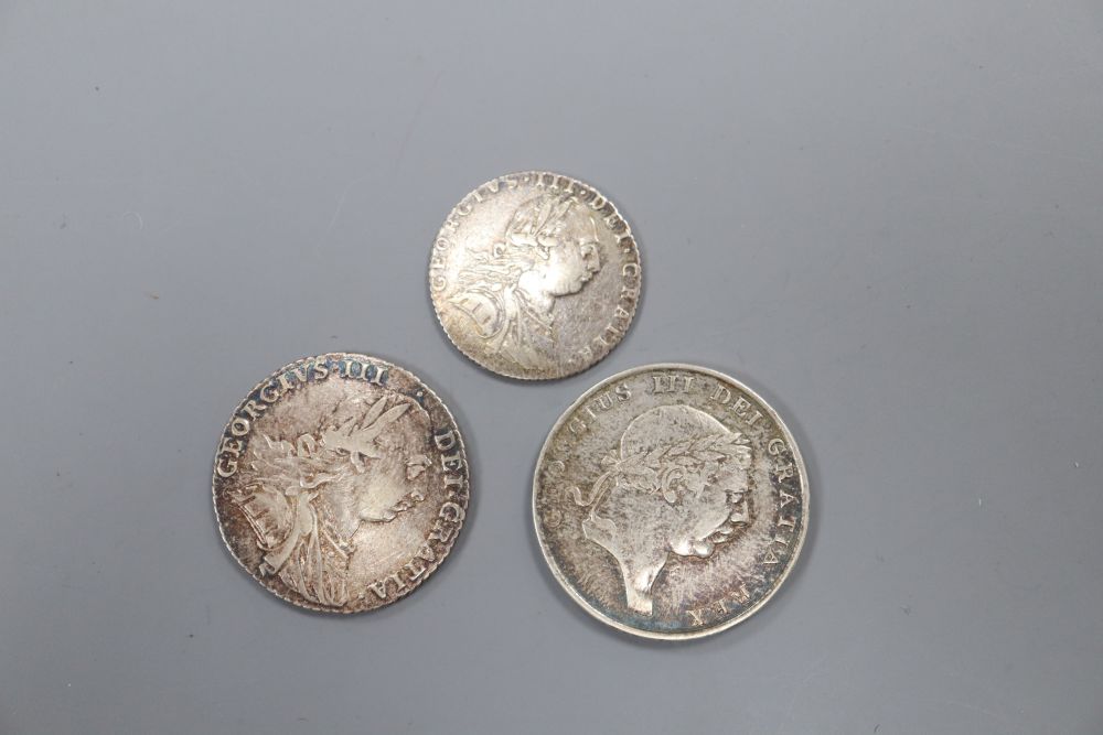 A George III shilling 1787, VF, a similar sixpence, VF and a George III bank token 1S6d, 1815.